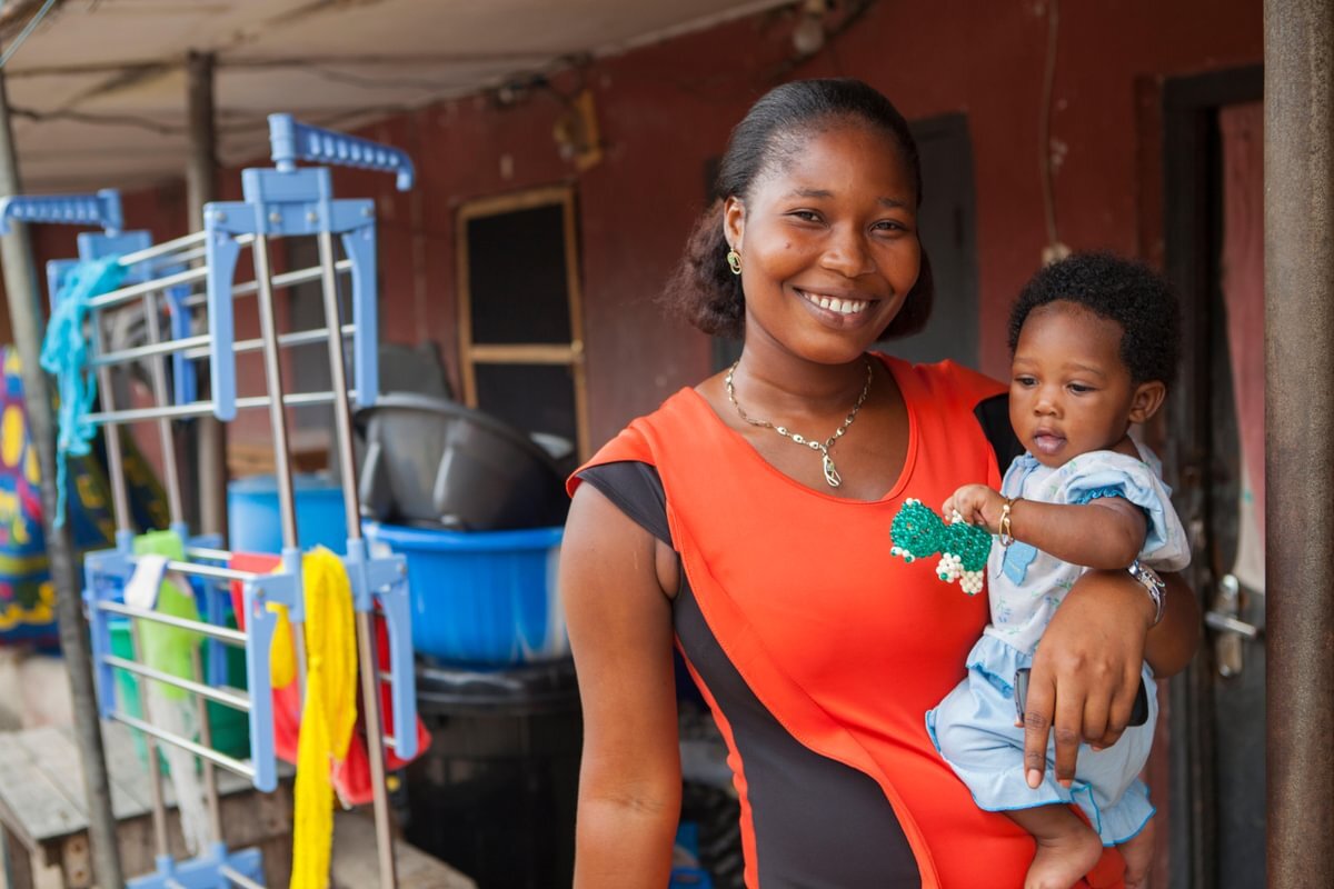 A nurse conducting a prenatal screening visit with a pregnant woman in Liberia
